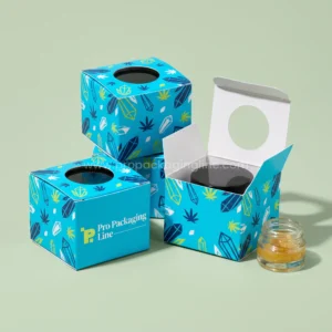 Custom electric cyan cube concentrate boxes with round top window and crystal print beside a wax jar