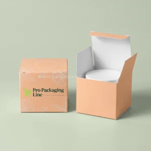 Two custom peach cream boxes with citrus line art, one closed and one open showing a cream jar inside