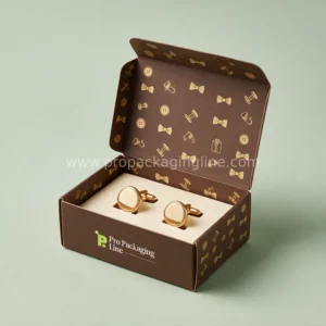Custom cufflink boxes - mocha folding cardstock cufflink box with tuck flap lid, cream card insert and gold menswear icon print by Pro Packaging Line