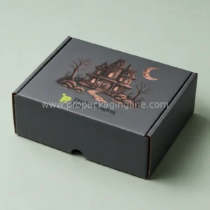 Custom Halloween corrugated mailer box in charcoal with copper haunted house artwork