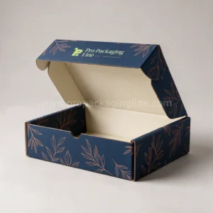 Custom navy blue tuck-top mailer box with copper botanical line art and cream printed interior by Pro Packaging Line
