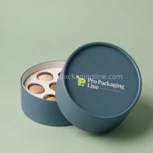 Custom slate blue round cardstock gift box with paperboard macaron insert by Pro Packaging Line