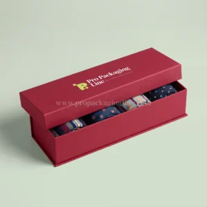 Ruby red magnetic socks gift box with rolled patterned socks, Pro Packaging Line logo